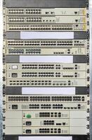 Network switches and routers stacked in a data center view showcasing connectivity technology photo