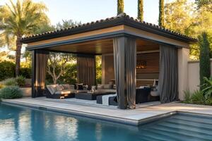 Luxurious gazebo overlooking swimming pool in modern backyard during sunset photo