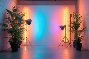 Photo studio with neon lights and tropical plants creating colorful backdrop