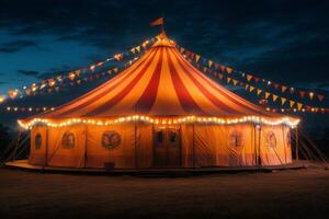 Illuminated circus tent glowing at twilight with colorful flags photo