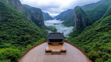 Majestic view of historic temple surrounded by lush mountains and mist photo