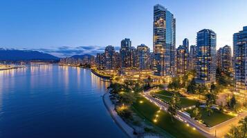 Stunning cityscape at dusk with illuminated buildings and waterfront views photo
