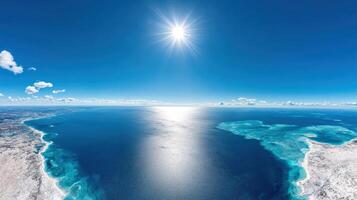 Breathtaking ocean view under bright sun with clear blue skies photo