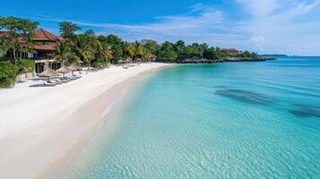 Stunning beach with clear turquoise water and palm trees under blue sky photo