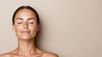 serene woman with glowing skin and closed eyes, radiating calmness photo
