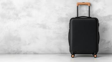 Isolated black suitcase with wooden handle against textured background photo