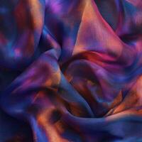 Colorful fabric with vibrant patterns draping elegantly in soft folds photo