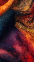 Colorful fabric draped in light showcasing rich textures and hues photo