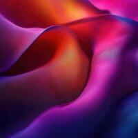 Vibrant colorful fabric draping in graceful folds and waves photo