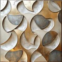 Abstract metal wall art with flowing shapes in gold and silver tones photo
