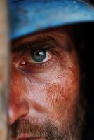 Miner close-up revealing determination and hard work in dim light photo