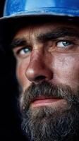 Miner with striking blue eyes and rugged beard showcasing hard work experience photo