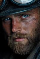Miner with intense gaze showcases dedication and hard work in the mines photo