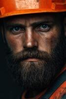 Miner with beard and helmet shows determination in rugged environment photo