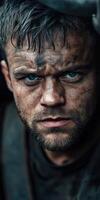 Miner focused on work with intense expression and dirt-streaked face photo