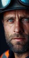 Miner with intense gaze showcasing hard work and determination photo