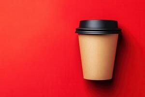 Coffee cup against a vibrant red background with minimalistic design photo