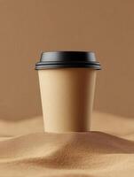 Cup in desert sand with minimalistic background and warm tones photo