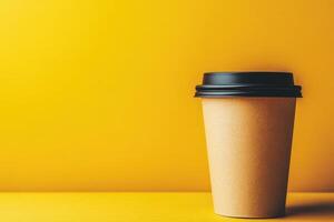 Empty coffee cup on a vibrant yellow background with simple elegance photo