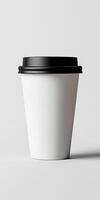 Simple white coffee cup on a plain background ready for a warm drink photo