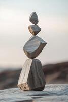 Balancing stones on a rocky surface during a calm sunset photo