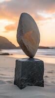 Balanced stones at sunset on a serene beach create a peaceful atmosphere photo