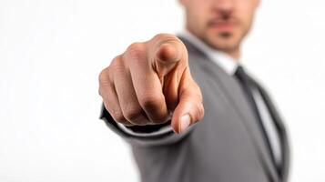 Confident businessman pointing hand in authoritative gesture in office photo