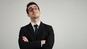 Confident Businessman in Suit Smiling at the in an Office Setting photo