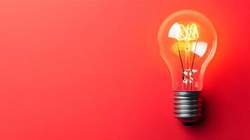 Bright Idea Illuminating Red Background for Business Concepts and Innovation Solutions photo