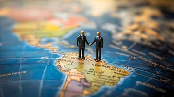 Two business professionals discussing opportunities and strategy while standing on a world map,representing global business growth and success. photo