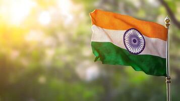 Vibrant Indian Flag Waving in the Wind Against a Blurred Scenic Backdrop photo