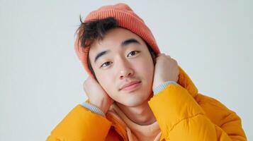Cheerful Young Asian Man Wearing Casual Outfit Smiling Confidently Outdoors photo