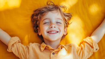 Carefree and Joyful Expression of a Smiling Young Boy in the Warm Summertime Sunshine photo
