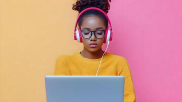 Focused Young Female Student Engaged in Serious Academic Research Using Laptop and Headphones on Bright Colorful Background in Modern Minimalist Studio Setting photo
