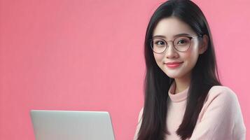 Confident and Smiling Woman Wearing Glasses Using Laptop Computer in Studio Background,Information Technology Specialist or Software Engineer photo