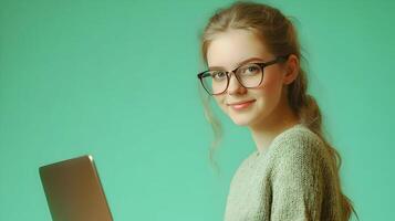 Confident and Intelligent Young Female IT Professional or Software Developer Sitting at Laptop Computer,Using Technology in Modern Office Environment photo