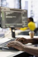 Programmer typing on keyboard, developing machine learning APIs solving complex problems. Close up of man writing code, training predictive models capable of handling complex tasks photo
