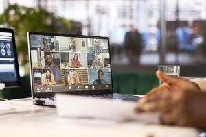 Businesswoman discussing with stakeholders in online videocall, developing sales strategies to increase market share. Close up of manager in videoconference meeting analyzing sales performance photo