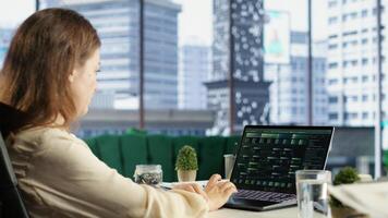 Forecast expert CEO analyzing investment insights and negotiations details, looking at data analytics and reports to establish the corporation vision and objectives. Business productivity. Camera B. photo