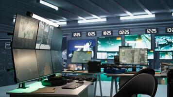 High tech room in army governmental establishment used for surveillance monitoring. Panning shot of empty military base of operations with radar systems, tracking enemy units photo