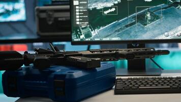 Weapons on table in empty control center housing operational missile defense system designed to intercept ballistic threats. Close up of guns in army headquarters used for tracking rockets with radar photo