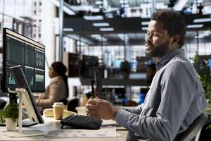 Professional black investor leads a teleconference with his staff, discussing project details and strategic objectives. Virtual chat meeting ensures efficient communication across locations. photo