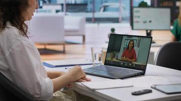 Human resources worker conducting a job interview via online videocall, using remote internet telecommunication to look for talented personnel. Employee interviewing woman on conference. Camera A. photo