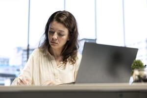Business director signing contracts and paperwork to approve the daily activity for enterprise management and development. Female CEO working with legal documents, authorization. photo