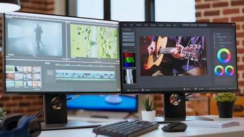 Empty editing tools and a color wheel running on pc at desk, timeline editing, color grading and media creation for a shoot. Post production software on dual monitors. photo