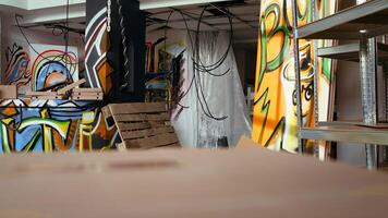 Empty building with destroyed items and graffiti paint, concept of subversive lifestyle. Criminal hideout used by teenagers to hangout and commit illegal drawing on walls photo