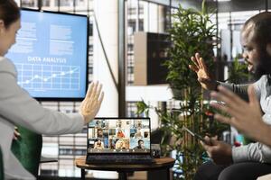 Business managers on videocall with CEO, attending briefing meeting to share new ideas to profit growth. Specialists using online telework call to explain startup evolution vision photo