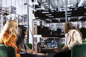 Empowered businesswomen team engage in a call with the CEO, discussing career developments and strategies for a global expansion in a multicultural work environment. Gender equality. photo