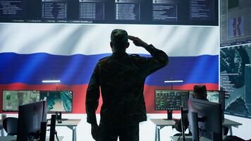 Army IT expert in control center collecting real time battlefield data, process satellite surveillance imagery for successful military defense mission. Using green screen isolated display. Camera A. photo