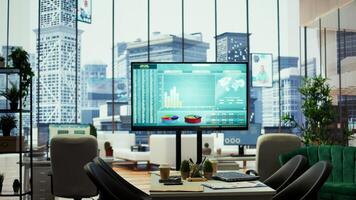 Sleek corporate office with a computer displaying detailed infographics, perfect for executive business meetings or financial planning and project development in a multinational company. photo